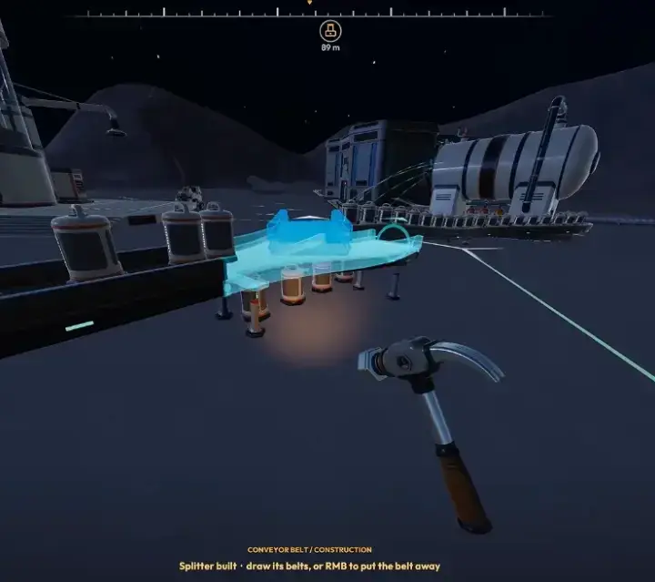 Newly built Splitter on a conveyor carrying dust capsules, with the prompt to draw its belts
