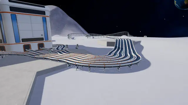 Bundle of conveyor belts raised on support legs, leaving open ground beneath them beside the station